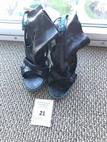 front view of both booties showing open toe, straps, size card