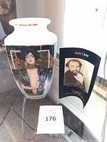 Front view of Goebel porcelain vase with Klimt artwork and info card