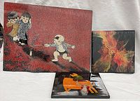 All three art pieces grouped: large eggshell lacquer panel, small lacquer panel, acrylic pour