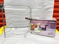 Rack and boxed apple peeler side by side