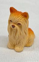 Front view of seated plastic Yorkie figurine