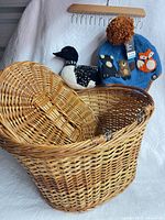 Wicker baskets, stuffed loon, blue wool hat displayed