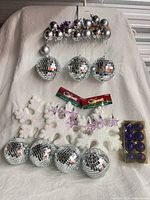 All ornaments displayed together on white cloth background