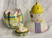 Three Easter-themed ceramic pieces together