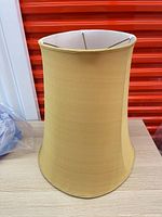 Exterior view of large tan fabric lamp shade