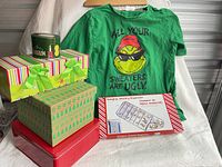 Lot overview with Grinch T-shirt, three gift boxes, jewelry organizer box and tape roll