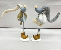 Both reindeer figurines facing each other on white bases