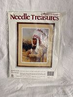 Front of sealed Needle Treasures Buffalo Caller stitchery kit showing artwork, model number, size and sealed plastic