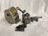 Front view of Chicago No.2 sharpener, slot machine sharpener, naval cannon sharpener and mortar sharpener