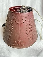 Overall view of punched-tin swag lamp with chain and cord