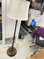 Full view of wood floor lamp with shade