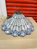 Full view of stained glass tulip shade with chain and wiring