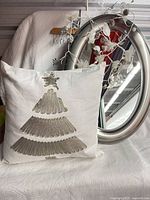 pillow, mirror and garland grouped together