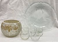 Group shot showing plate, mosaic bowl, eight votive holders