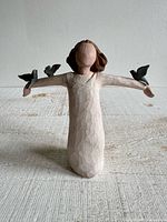 Front view of Willow Tree Happiness figurine