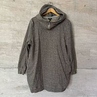 Full front view of grey knit hooded sweater on hanger
