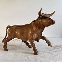 Front angle showing full charging bull sculpture