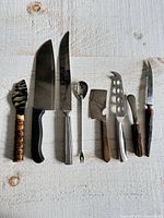All eight utensils laid out side by side