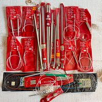 Overview of all packaged circular needles, straight needles, Phildar pack, and accessories