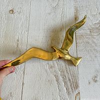 Full view of brass seagull showing entire shape and size