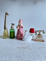 All six Avon perfume bottles displayed front view