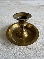 Top angled view showing overall candlestick holder form and brass material
