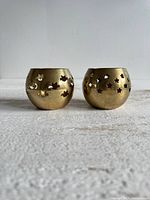 Both brass tealight holders front view