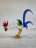 Full side view of multicolor glass rooster figurine