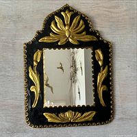 front view of mirror showing frame and brass detailing