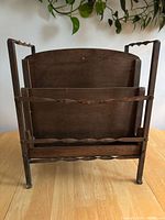 Front view of wood and metal magazine rack