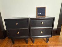 Front view of both black nightstands