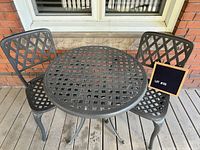 Table and two chairs front view