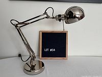 Full view of chrome adjustable desk lamp