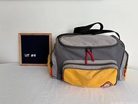 Exterior of gray and yellow tackle bag