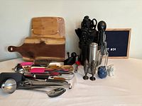 Overall lot view showing knife block, cutting boards, utensils, shakers, dispenser