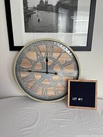 Front view of round wall clock showing design and scale