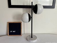 Full view of lamp showing dual shades, stem, marble base