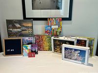 Group shot of six puzzles, inflatable mat, poetry kit, mindfulness cards