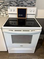 Front view of Whirlpool range showing controls and cooktop
