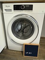 Front view of Whirlpool WFW5090GW washer showing door, control panel and exterior condition