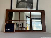 Front view of wood six-pane mirror placed horizontally