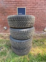 Stacked view of all four tires showing tread pattern and quantity