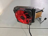 Cooler angled showing red 120 mm fan on radiator