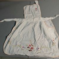 Apron full view showing embroidery and pocket