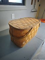 Front angled view showing basket shape, handle, weave