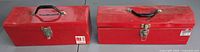 Both red tool boxes closed, side by side showing size and condition