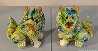 Both foo dog figurines front facing