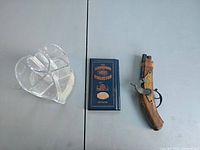 Full lot showing acrylic organizer, penny album, toy flintlock pistol