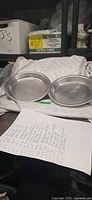 Both aluminum pie plates side by side