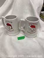 Front view showing both mugs with graphic and text